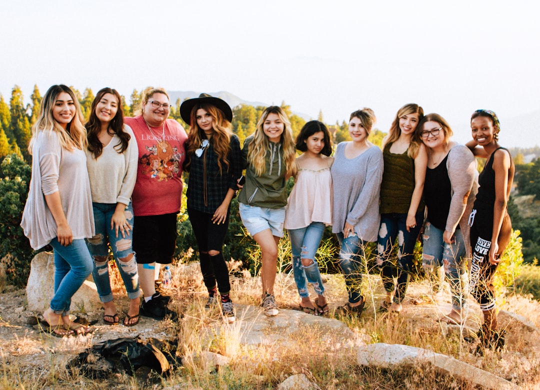 Diverse group of smiling people outdoors illustrating purposeful living through connection