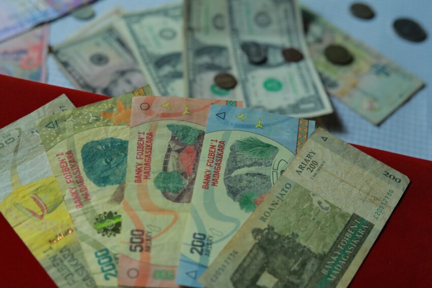 Conceptual hourglass and coins representing strategies to maximize Social Security benefits