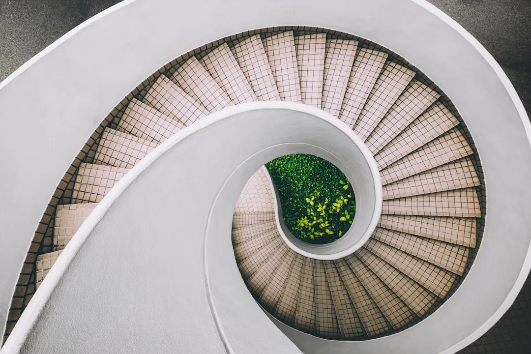 A person ascending bright stairs as a metaphor for process over outcome growth