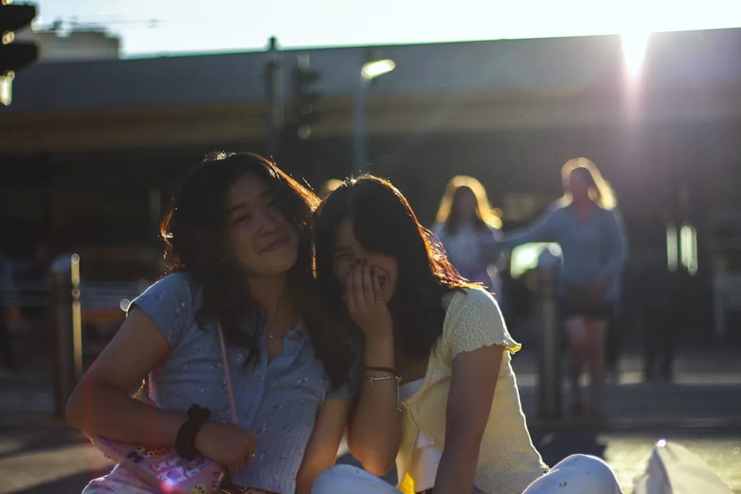 Build Confidence by connecting with supportive friends outdoors in a bright setting