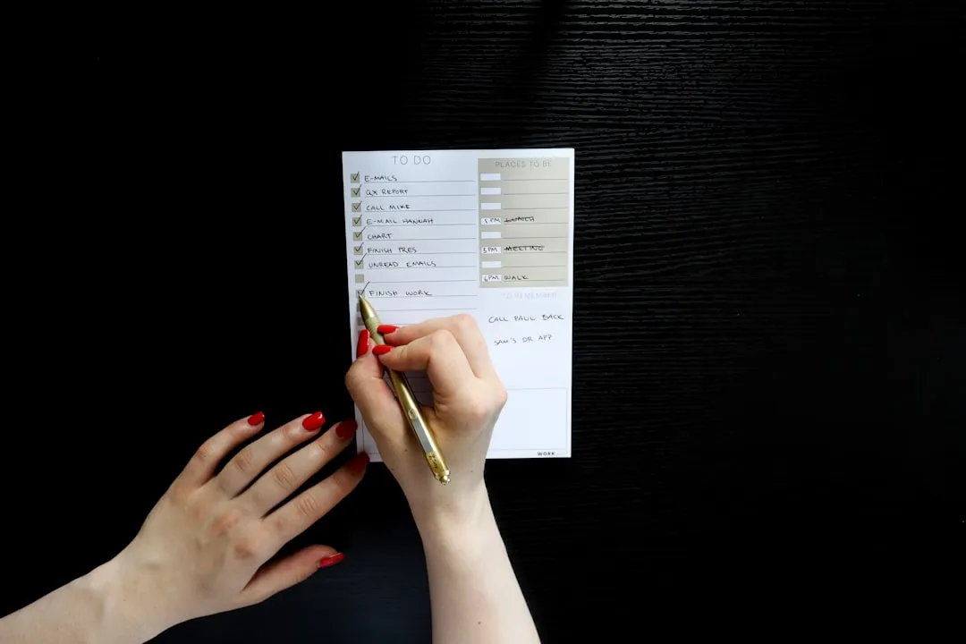 Professional using Work Breakdown Strategies by creating an organized task checklist